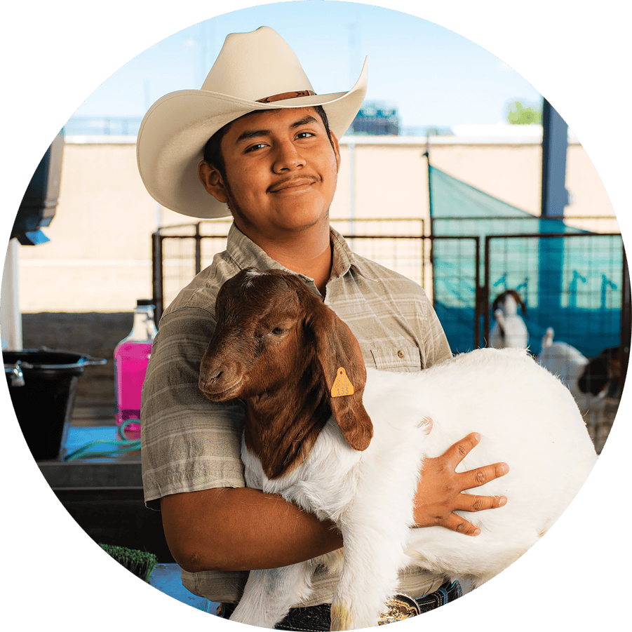 Member Holding a Goat
